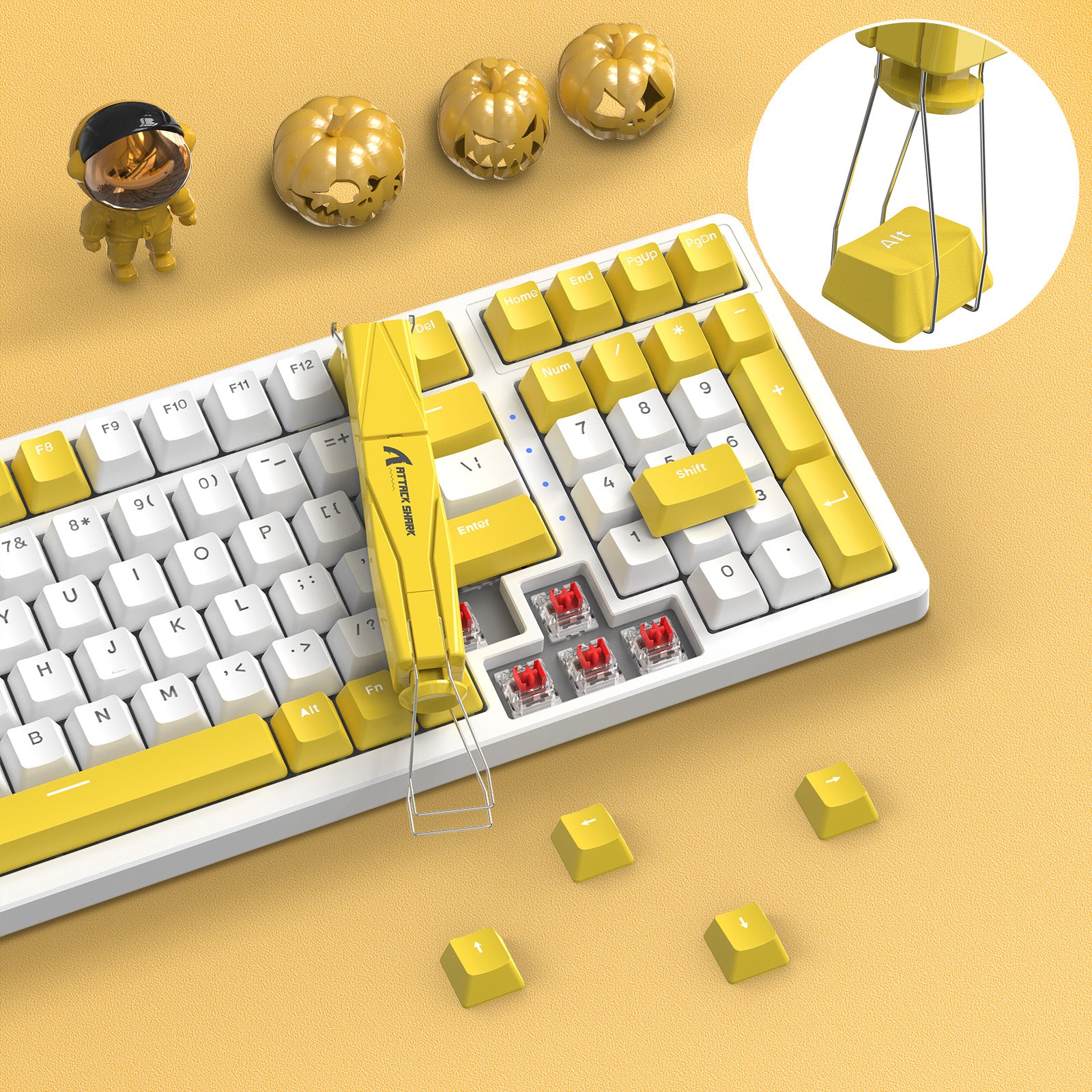 Yellow Attack Shark 2-in-1 keycap and switch puller on keyboard with yellow keycaps.